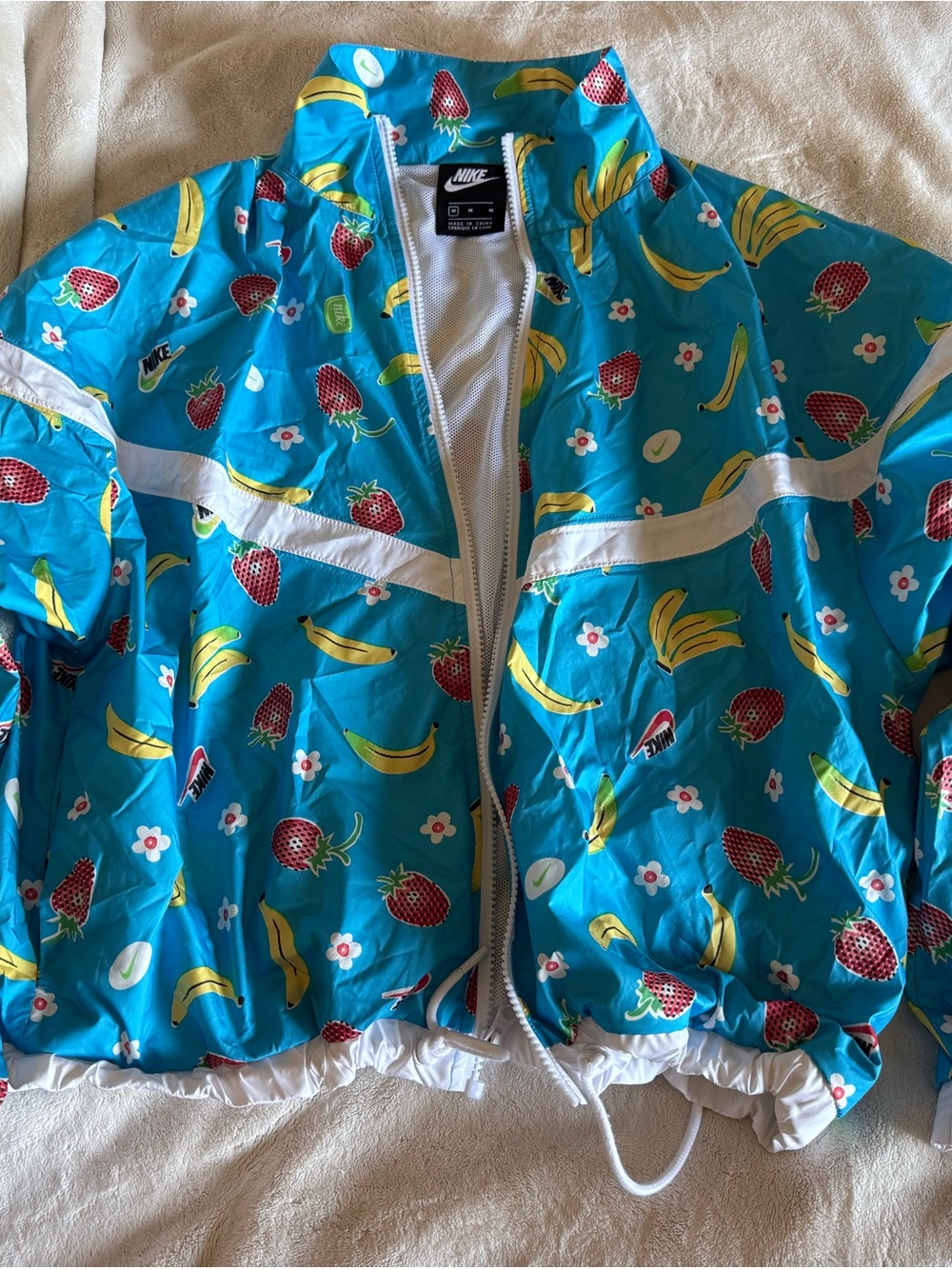 Nike women Blue Fruit-Print Rain Jacket with White Trim